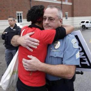 Which officer is braver? This photo went viral because this expression love is radically brave on both sides.